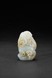 A SMALL WHITE JADE CARVING OF QILIN 