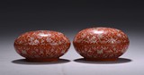 A PAIR OF CORAL-RED 'FLORAL SCROLLS' PASTE BOXES