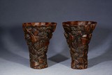 A PAIR OF AGARWOOD CARVED LIBATION CUPS