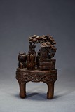 AN AGARWOOD CARVING OF SCHOLAR OBJECTS