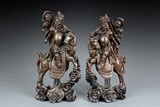 A PAIR OF ROSEWOOD GUAN YU CARVINGS WITH SILVER LINES