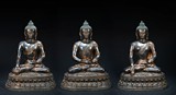 A SET OF THREE LARGE BRONZE STATUES OF SEATED BUDDHA
