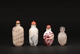 A SET OF FOUR AGATE AND GLASS SNUFF BOTTLES