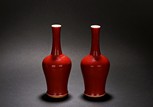 A PAIR OF RED GLAZED 'MALLET' VASES