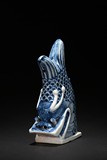 A BLUE AND WHITE PORCELAIN TILE FISH WITH DRAGON HEAD