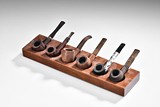 A GROUP OF SIX SMOKING PIPES