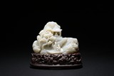 A FINELY CARVED WHITE JADE MOUNTAIN