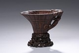 AN AGARWOOD CARVED LIBATION CUP