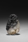 A WHITE AND BLACK JADE CARVING OF DRAGON AND PHOENIX