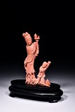 A CORAL CARVED FIGURAL GROUP