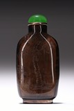 A CARVED FIGURE CITRINE GLASS SNUFF BOTTLE