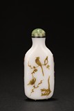 A BLACK OVERLAY 'FLOWER AND BIRD' ON WHITE GLASS SNUFF BOTTLE