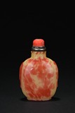 A RARE RED TINTED WITH YELLOW GLASS SNUFF BOTTLE
