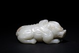 A WHITE JADE CARVED MYTHICAL BEAST