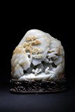 A WHITE JADE CARVED 'FIGURES' MOUNTAIN BOULDER