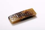 A WHITE AND RUSSET JADE SWORD SLIDE