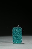 A TURQUOISE-GREEN GLASS 'GOURDS' PENDANT