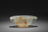A WHITE AND RUSSET JADE VESSEL 