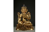 A GILT-BRONZE AND PAINTED FIGURE OF GREEN TARA