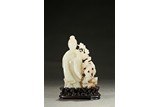 A WHITE JADE CARVED FIGURAL GROUP