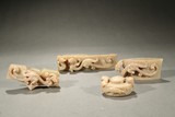 A SET OF FOUR JADE SWORD FITTINGS
