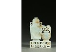 A WHITE JADE 'TAOTIE AND PLUM BLOSSOM' VASE GROUP