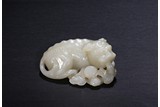 A WHITE JADE MYTHICAL BEAST PAPERWEIGHT