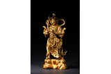 A GILT-LACQUERED BRONZE FIGURE OF BUDDHIST GUARDIAN