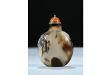 A CARVED SILHOUETTE AGATE SNUFF BOTTLE