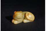 A YELLOW JADE RECUMBENT MYTHICAL BEAST