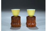 A PAIR OF LEMON YELLOW GLAZED CUPS WITH STANDS