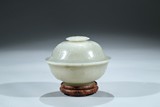A WHITE JADE CARVED BOWL AND COVER