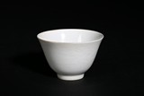 A WHITE GLAZE ANHUA-DECORATED DRAGON CUP