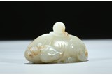 A WHITE JADE CARVED RECUMBENT DEER-FORM WATER COUPE