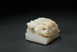 A WHITE JADE CARVED 'CHILONG' SEAL