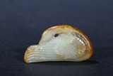 A WHITE AND RUSSET JADE CARVED GOOSE