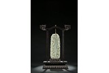 A CHINESE CELADON JADE 'CHILONG' HANGING PENDANT WITH STAND