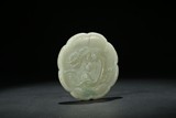 A WHITE JADE CARVING OF LOBED 'CHILONG' MIRROR