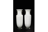 A PAIR OF WHITE GLASS VASES