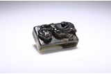 A BLACK AND WHITE JADE 'CHILONG' SCABBARD SLIDE
