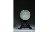 A LARGE JADE CARVED CIRCULAR TABLE SCREEN