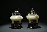A PAIR OF WHITE JADE TRIPOD CENSERS WITH ZITAN COVER STAND