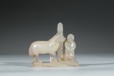A CARVED AGATE 'HORSE AND FIGURE' GROUP