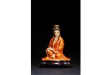A CORAL-RED GLAZED FIGURE OF GUANYIN