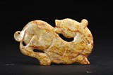 AN ARCHAIC RUSSET JADE CARVING OF HORSE