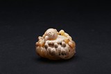 AN ARCHAIC JADE 'MAGPIES' CARVING