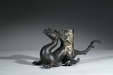 A SILVER MODEL OF MYTHICAL BEAST AND FIGURE