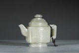 A CARVED WHITE JADE TEAPOT AND COVER