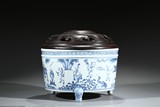 A BLUE AND WHITE 'FIGURES' TRIPOD CENSER 