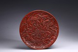 A CARVED CINNABAR LACQUER 'FLOWER' DISH